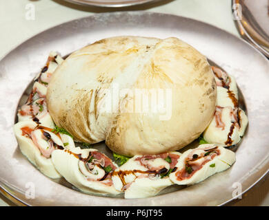 Smoked provola, traditional italian cheese in a tray Stock Photo