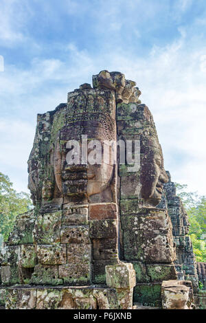 Bayon is richly decorated Khmer temple at Angkor in Cambodia. Built in 12th century as official state temple of Mahayana Buddhist King. It stands at t Stock Photo