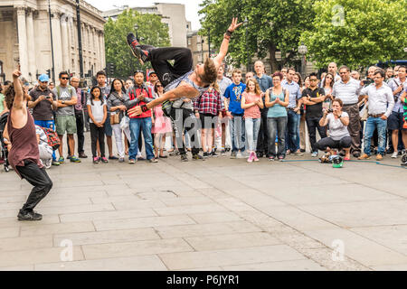 Street entertainers wowing the crowds in front of National Gallery London United Kingdom. Stock Photo