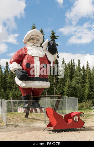 The worlds largest Santa Claus statue at the Santa Claus House in North Pole, Alaska. The 42-foot statue weighs 900 pounds and was originally built in the 1960s and originally served as a seasonal display at the Westlake Mall in Seattle before being relocated to North Pole. Stock Photo