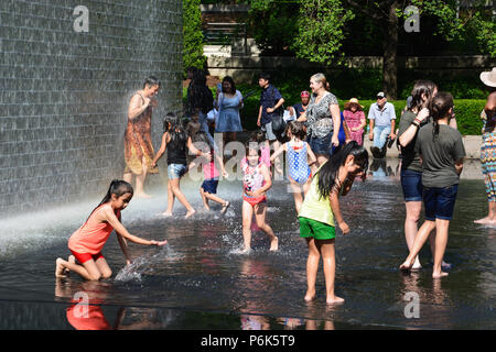 Kids cool off in the Crown Fountains in Chicago's Millennium Park on a hot summer afternoon. Stock Photo