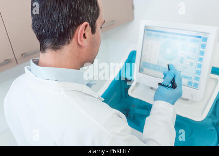 Doctor preparing a blood count in the laboratory Stock Photo