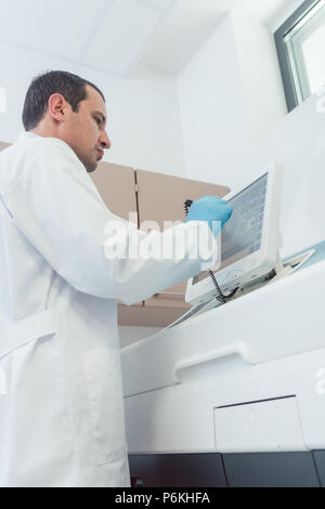 Doctor preparing a blood count in the laboratory Stock Photo