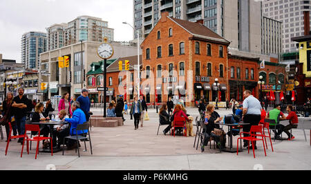 Ottawa, Canada - May 15, 2017. People sitting at outdoor coffee shop in Ottawa, Canada. Queen Victoria chose Ottawa as the capital of Canada in 1857. Stock Photo