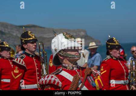 Armed Forces Day 2018 in Llandudno. Marching solders in red uniforms. A very hot day. soldiers sweating in uniform. Stock Photo