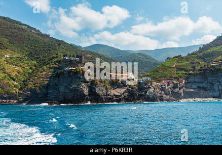 Beautiful summer Vernazza view from excursion ship. One of five famous villages of Cinque Terre National Park in Liguria, Italy, suspended between Lig Stock Photo