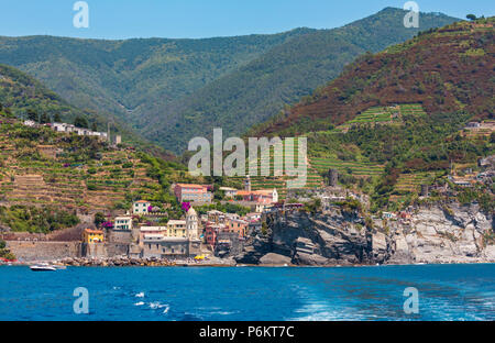 Beautiful summer Vernazza view from excursion ship. One of five famous villages of Cinque Terre National Park in Liguria, Italy. Stock Photo