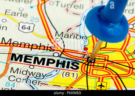 Memphis Tennessee highlighted with blue push pin on atlas or map closeup