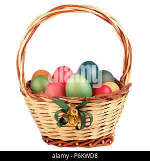 Wricked Easter basket filled with colored eggs isolated Stock Photo