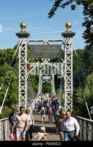 The Queens Park suspension bridge over the River Dee at The Groves in Chester UK Stock Photo
