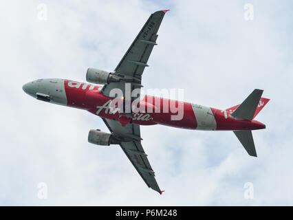 Phuket, Thailand - Apr 23, 2018. An Airbus A320 airplane of AirAsia taking-off from Phuket International Airport (HKT). Stock Photo