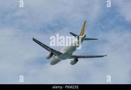Phuket, Thailand - Apr 23, 2018. An Airbus A320 airplane of Scoot taking-off from Phuket International Airport (HKT). Stock Photo