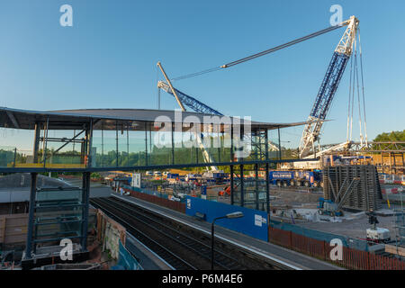 Telford Central Station, Telford, Shropshire, UK, Sunday July 1st 2018.  One of Europe's largest mobile cranes lifts a new section of railway footbridge into place over the railway line next to the A442 Queensway Road, Telford.  The 95 ton Liebherr LG1750 mobile crane lifed the first crossing section onto it's mounts in the early hours of Sunday morning 1st July 2018.  The civil engineering project is replacing the original footbridge at a cost of around £10 million. Credit: AMD Images/Alamy Live News Stock Photo