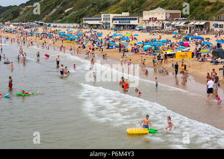 Bournemouth, Dorset, UK. 1st July 2018. UK weather: hazy sunshine, but still warm as thousands of sunseekers head to the beaches at Bournemouth to enjoy a day at the seaside. Credit: Carolyn Jenkins/Alamy Live News Stock Photo