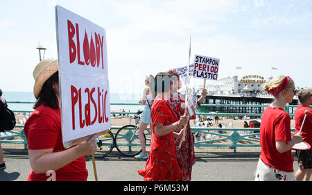 Brighton UK 1st July 2018  - People take part in the Plastic Free Period Products protest parade in Brighton on a beautiful hot sunny day To mark the beginning of the campaign to show your #periodpower this July Natracare the UKs leading plastic free period brand has joined forces with the Marine Conservation Society to reveal the shocking environmental impacts of period waste on the UK coastline Credit: Simon Dack/Alamy Live News Stock Photo