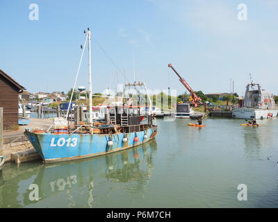 Queenborough, Kent, UK. 1st July, 2018. UK Weather: a sunny and warm afternoon in Queenborough, Kent. A fishing trawler at high tide in  Queenborough creek. Credit: James Bell/Alamy Live News Stock Photo