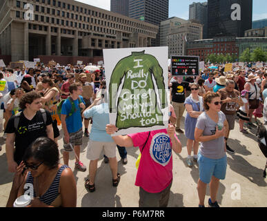 Boston, Massachusetts, USA. 30th June, 2018.  U.S. Demonstrator holding a sign mocking the Jacket that First Lady, Melania Trump wore before visiting a Texas detention shelter. Thousands Gathered in City Hall Plaza in Boston, MA during the Rally against Family Separation by the current United States administration. Rallies against U.S. President Donald Trump’s policy of the detention of immigrants and immigrant families separated by U.S. customs and border agents (I.C.E.) took place in more than 750 US cities on June 30th. Credit: Chuck Nacke/Alamy Live News Stock Photo