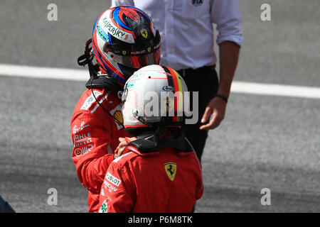 Red Bull Ring, Spielberg, Austria. 1st July, 2018. Austrian Formula One Grand Prix, Sunday race day; Scuderia Ferrari, Kimi Raikkonen and Sebastian Vettel chat after their 2nd and 3rd place for Ferrari Credit: Action Plus Sports/Alamy Live News Stock Photo