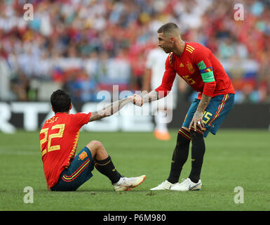 Moscow, Russia. 1st July, 2018. Spain's Sergio Ramos (R) pulls up his teammate Isco during the 2018 FIFA World Cup round of 16 match between Spain and Russia in Moscow, Russia, July 1, 2018. Credit: Xu Zijian/Xinhua/Alamy Live News Stock Photo