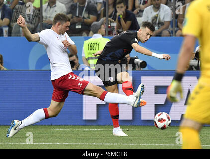 Nizhny Novgorod, Russia. 1st July, 2018. Ivan Perisic (R) of Croatia passes the ball during the 2018 FIFA World Cup round of 16 match between Croatia and Denmark in Nizhny Novgorod, Russia, July 1, 2018. Credit: He Canling/Xinhua/Alamy Live News Stock Photo