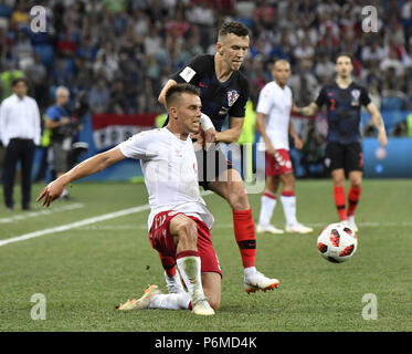 Nizhny Novgorod, Russia. 1st July, 2018. Ivan Perisic (top) of Croatia vies with Jonas Knudsen of Denmark during the 2018 FIFA World Cup round of 16 match between Croatia and Denmark in Nizhny Novgorod, Russia, July 1, 2018. Credit: He Canling/Xinhua/Alamy Live News Stock Photo