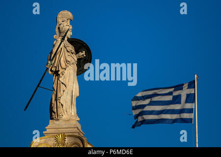 Athens, Greece. 29th June, 2018. A Greek flag waves by the statue of the goddess Athena, in Athens on June 29, 2018. Credit: Angelos Tzortzinis/dpa/Alamy Live News Stock Photo