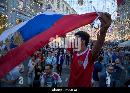 Moscow, Russia. 1st July, 2018.  Fans celebrate Russia's victory in 2018 FIFA World Cup Round of 16 match against Spain on Nikolskaya street in central Moscow, Russia Credit: Nikolay Vinokurov/Alamy Live News Stock Photo