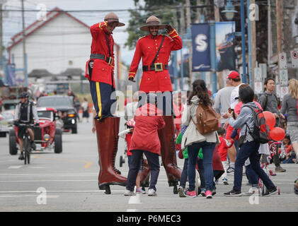 Richmond, Canada. 1st July, 2018. Performers interact with the crowds during the 73rd Salmon Festival Parade in Richmond, Canada, July 1, 2018. Thousands of people participated in the 73rd Salmon Festival Parade in Richmond on Sunday to celebrate the Canada Day. Credit: Liang Sen/Xinhua/Alamy Live News Stock Photo