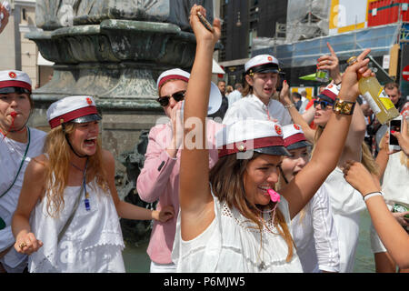 Danish students celebrate their high school graduation with the traditional dance round and plunge into the Stork Fountain on Stroeget in Copenhagen. Stock Photo