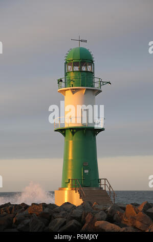 Warnemuende, lighthouse on the west pier in the evening light Stock Photo