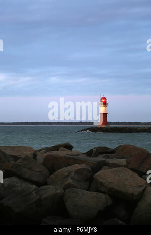 Warnemuende, lighthouse on the east pier in the evening light
