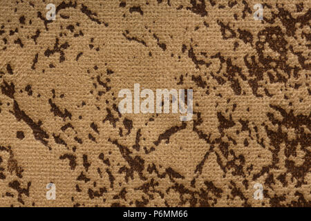 Mottled textile background in beige-brown hue. High resolution photo. Stock Photo