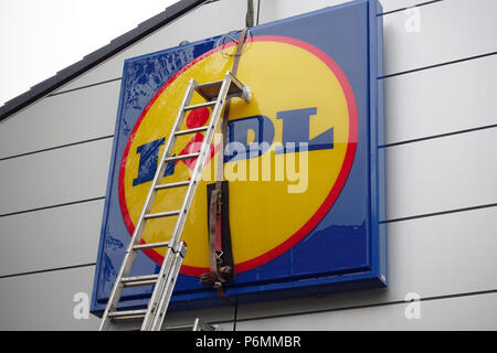 Berlin, Germany, company sign of the discounter Lidl is mounted on the facade of a store Stock Photo