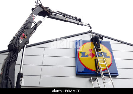 Berlin, Germany, company sign of the discounter Lidl is mounted on the facade of a store Stock Photo