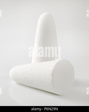 two white sugar loaves or cones on white background Stock Photo