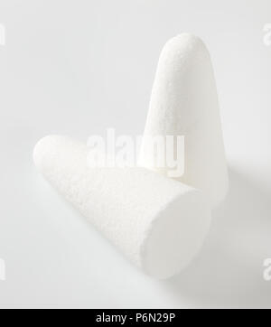 two white sugar loaves or cones on white background Stock Photo