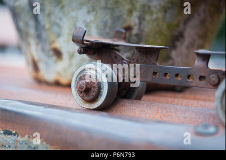 Old roller skate outside the row of miners cottages at The Museum of Welsh Life, St Fagans, near Cardiff, South Wales Stock Photo