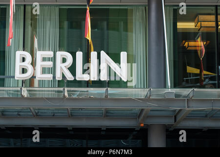The word BERLIN in neon letters on building facade Stock Photo