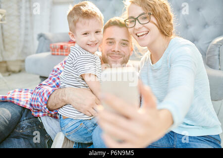 Modern Family Taking Selfie at Home Stock Photo