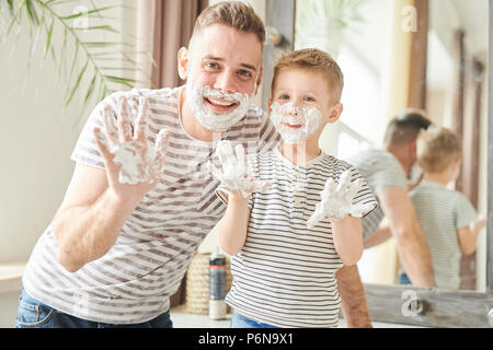 Funny Father and Son Covered in Shaving Foam Stock Photo