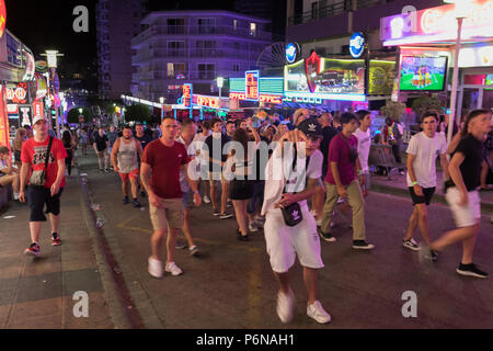 Magaluf tourists Punta Ballena nightclub, Crowd of people tourists walking in street, Mallorca Spain vacation Europe Stock Photo