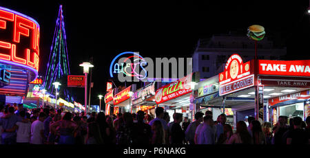 Magaluf tourists Punta Ballena nightclub, Crowd of people tourists walking in street, Mallorca Spain vacation Europe Stock Photo