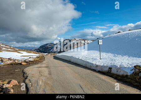 The Meall Gorm ridge and a passing place sign near the summit of the Bealach na Bà road, in the Applecross hills, Highland Region, Scotland, UK Stock Photo