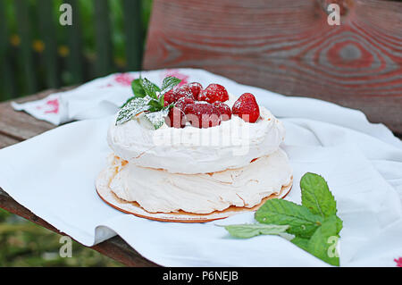 meringue pie with strawberries on a towel, on a substrate Stock Photo