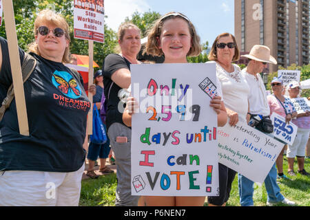 MINNEAPOLIS, MN/USA - JUNE 30, 2018: Unidentified individuals participating in the Families Belong Together march.