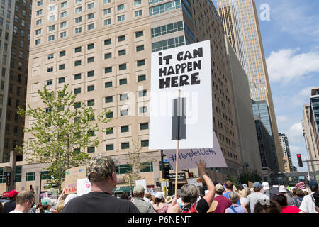 MINNEAPOLIS, MN/USA - JUNE 30, 2018: Unidentified individuals participating in the Families Belong Together march.