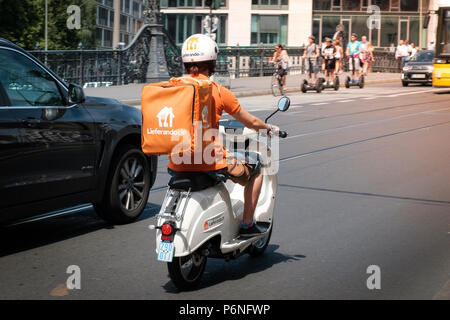 delivery driver berlin motorbike loaded riding along fast road germany alamy lieferando june