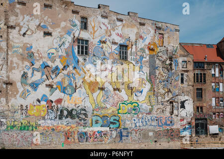 Berlin, Germany - june 2018: Graffiti and mural paintings on building facade next to Kunsthaus Tacheles, a former art center in Berlin, Germany