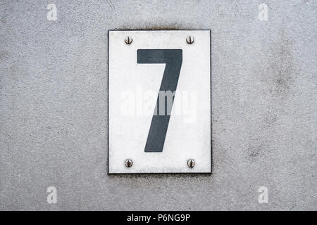 Number 7 / seven on metal background / house number Stock Photo