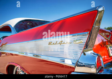 Tail fin and taillight details of a red 1957 Chevrolet Bel Air classic car. American Classic Car. Stock Photo